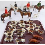 A 29-piece Beswick hunting group: 5 horse-and-rider figures, 22 foxhounds and 2 foxes (various