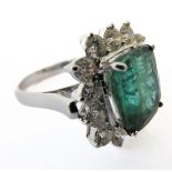 An 18-carat large emerald and diamond-set ring