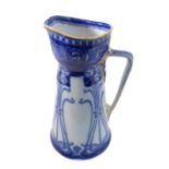 A large late 19th / early 20th century Royal Doulton pitcher decorated in underglaze blue in high