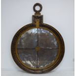 A large circular late-19th century four sectional mirror of neo-classical inspiration; the