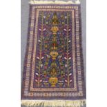 A modern Belouch carpet from Afghanistan with three central, two-handled urns with stylised