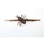 A Victorian gold 'spider' brooch set with amethysts