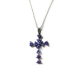 A silver crucifix set with ten tanzanites upon a silver chain (the crucifix 3.5 cm including