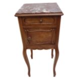 An early 20th century French marble-topped walnut bedroom-style cabinet; moulded inset marble top,