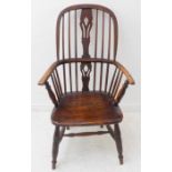 A 19th century Windsor chair; ash bow, pierced splat, shaped elm seat and turned splayed front