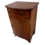 An early 20th century bow-fronted side cabinet in figured mahogany: the crossbanded overhanging