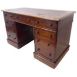 A 19th century mahogany pedestal desk; the rexine insert thumbnail moulded top above an