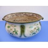 A large Edwardian two-handled footbath decorated with flowers (now as a planter) (47cm wide