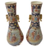 A pair of large floor-standing baluster-shaped Japanese ceramic vases; each with flaring neck