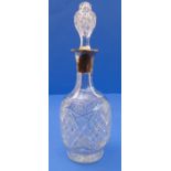 A fine cut-glass mallet-shaped decanter and stopper having a hallmarked silver mounted collar,