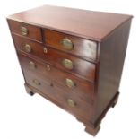 A late 18th century mahogany chest; the thumbnail moulded top above two half-width and three full-