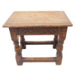 A late 17th century style (later) oak joint stool; the moulded top above an incised frieze in