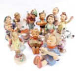 13 West German style hand-decorated porcelain figure models of young children and two cats including