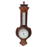 A late 19th century rosewood and marquetry wall-hanging barometer: the pediment with flowerheads and