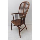 A good mid-19th century Windsor chair; ash bow, pierced splat and figured elm seat, turned and