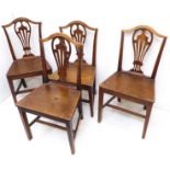 A set of four late 18th century George III period vernacular oak salon chairs; pierced splats, solid
