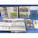 Approx. 174 mint GB presentation packs, 42 first day covers and an Improved Postage Stamp Album