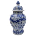 A large Chinese porcelain blue and white decorated baluster-shaped vase and cover in 17th century