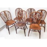 Six 19th century wheelback Windsor-style chairs; pierced wheelback splats and comb-style uprights,