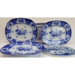 Three matching 19th century blue-and-white meat platters (the largest 57cm wide), together with a