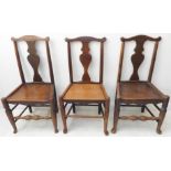 A matched set of three 18th century vernacular oak/ash side chairs; each with yoke shaped top