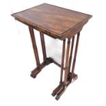 A late Regency nest of two coromandel tables; turned tapering legs and scroll feet (74cm high)