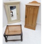 An early 20th century stripped oak bedside-style cabinet, a white-painted mirror-fronted wall-