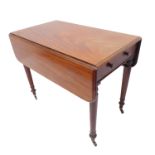 A mid-19th century mahogany Pembroke table; true end-drawer and dummy drawer opposing, flanked by