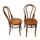 A pair of nicely patinated early 20th century bentwood chairs; each with circular seat with