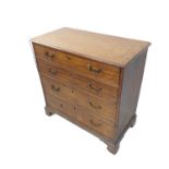 A late 18th century oak chest; the moulded top above four full-width graduated drawers, brass swan