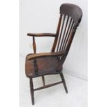A late 19th century lathe-back chair having patinated elm seat