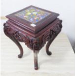 An early to mid 20th century ornately carved Chinese softwood jardinière stand; the central top