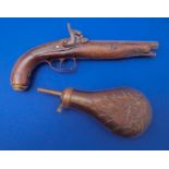 A 19th century percussion pistol and an ornate copper powder/shot flask Condition Report: The moving