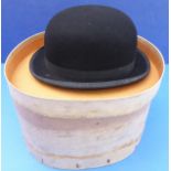 A Lock & Co bowler hat in good overall condition (size 6 7/8), in a Hilhouse cardboard hat box