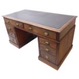 A 19th century mahogany pedestal desk; the black leather inset thumbnail moulded top above an