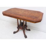 A 19th century figured walnut and amboyna crossbanded centre table: with canted corners, turned