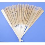 An early 20th century Oriental Brise fan of lacework and bone sticks, decorated with swallows and