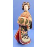 A large late 19th / early 20th century hand-decorated and gilded Japanese porcelain model of a