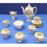 A Royal Doulton porcelain coffee service for six in the Thistle pattern and signed 'P Curnock'