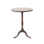 A George III period circular-topped oak occasional table; turned stem and tripod base with endearing