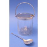 An early 20th century silver-mounted glass preserve pail with swing-handle, hinged lid and
