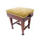 An early 20th century adjustable mahogany piano stool with a green velour top (50 cm wide)