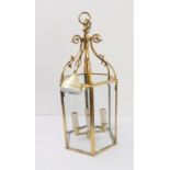 A hexagonal gilt-brass four-light ceiling-hanging lantern (55.5cm high)