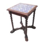 An unusual late 19th century square oak centre table; four blue-and-white ceramic tiles with a