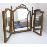 An early 20th century triple gilt-framed dressing table mirror in late 18th century Louis XVI style