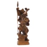 A well-defined carved softwood Italianate figure of St. Florian with plumed helmet and holding a