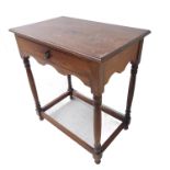 An early 20th century oak side table in 18th century style; the thumbnail-moulded top above a single