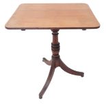 An early 19th century Regency period tilt top mahogany occasional table; turned stem and raised on