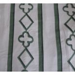 A pair of green and cream curtains edged with olive green tape, triple pinch pleat heading,