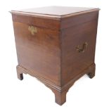 A George III period oak commode box; the moulded top with butterfly hinges, two brass swan neck side